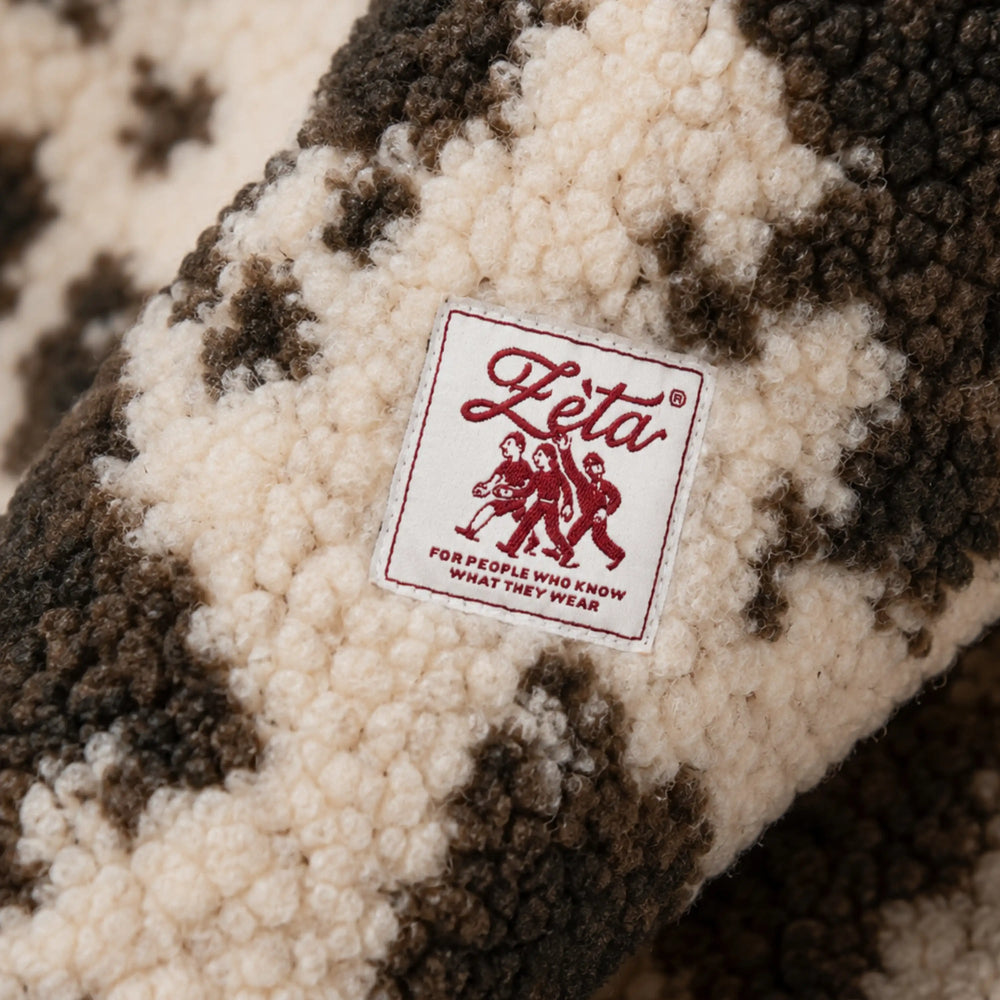 Cow-print sleeveless sherpa jacket