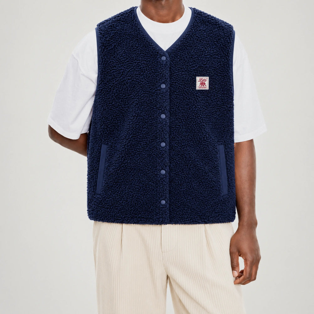Navy blue sleeveless sherpa jacket